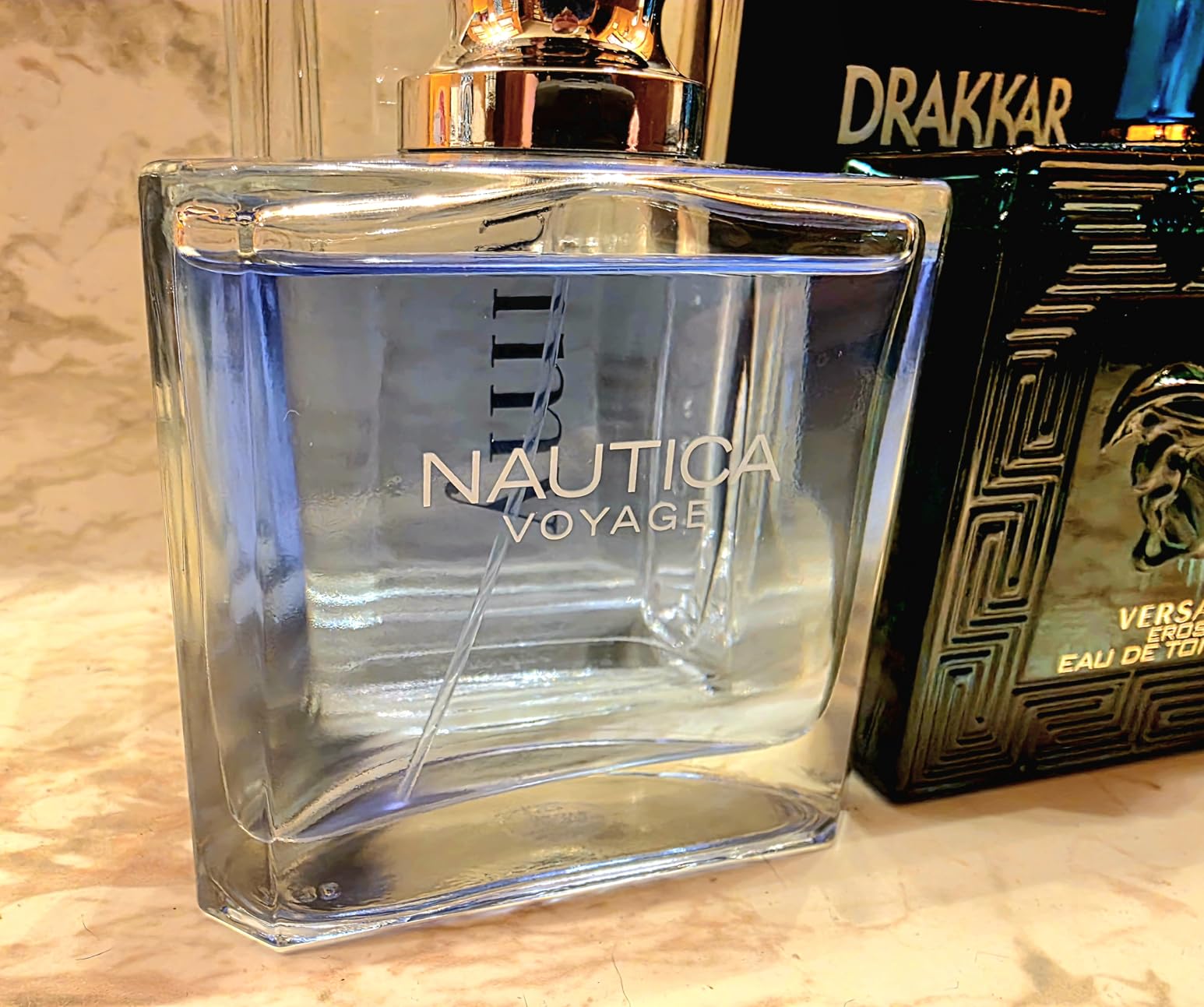 Nautica Voyage Eau De Toilette, Cologne and Fragrance For Men, Fresh, Romantic, Fruity Scent Woody, Aquatic Notes of Apple, Water Lotus, Cedarwood, and Musk Ideal Day Wear, Long Lasting 3.3Fl oz customer photo 2