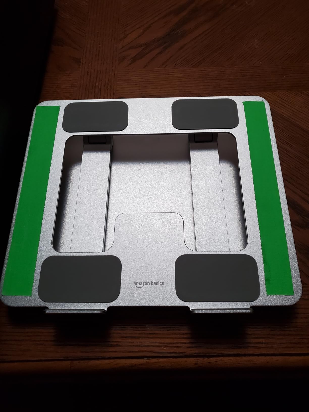 Amazon Basics Sturdy and Portable Ergonomic Laptop Stand for Desk, Height Adjustable Riser with Ventilated Cooling, Foldable, Fits all Laptops up to 17.3 Inch, Silver, 10 x 8.7 x 6 in customer photo 1