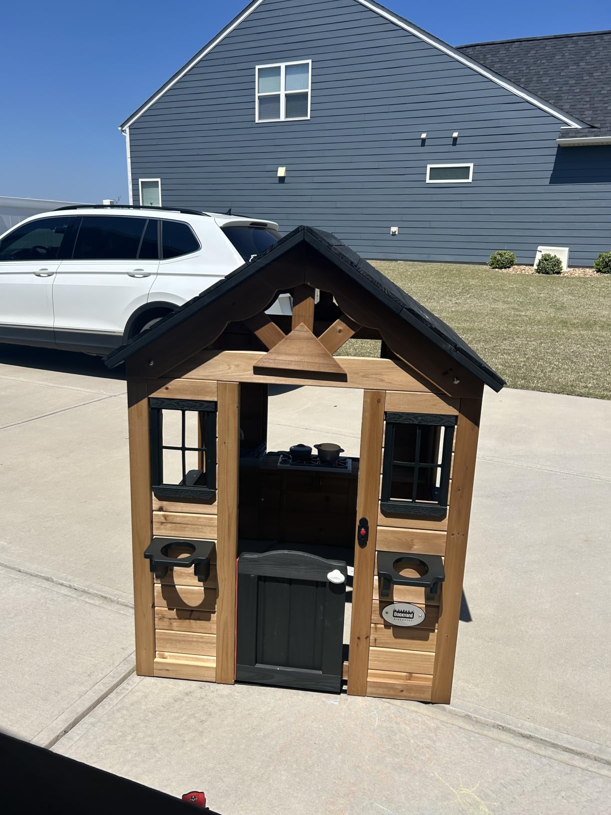 Backyard Discovery Sweetwater Cedar Wooden Kids Playhouse Cottage with Play Kitchen, Snack Bar, Half Door, Toy Phone, Windows, Flowerpot Holders, and Working Doorbell for Outdoor Imaginative Play customer photo 1