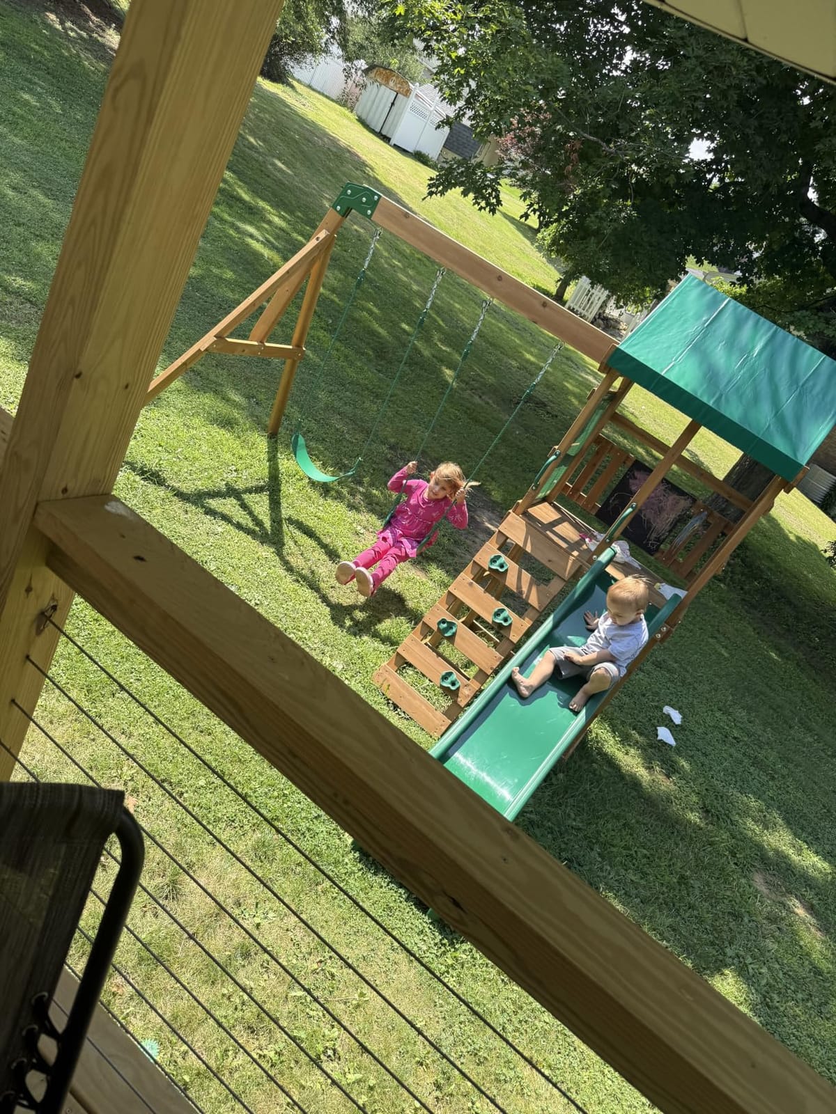 Backyard Discovery Buckley Hill Cedar Wood Swing Set with Wave Slide, Play Deck, Rock Wall Ladder, Belt Swings, Chalkboard, Canopy Roof, Outdoor Playset customer photo 2