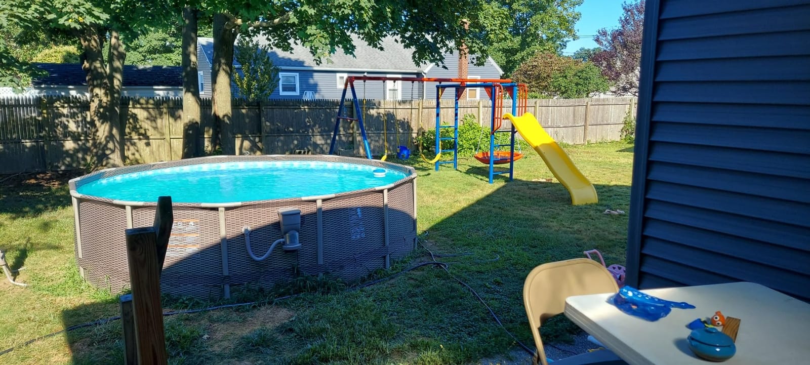 Lifetime 91028 Monkey Bar Adventure Swing Set with 3 Swings, Trapeze Bar, 9-Foot Slide and Fireman's Pole, Earthtone customer photo 1