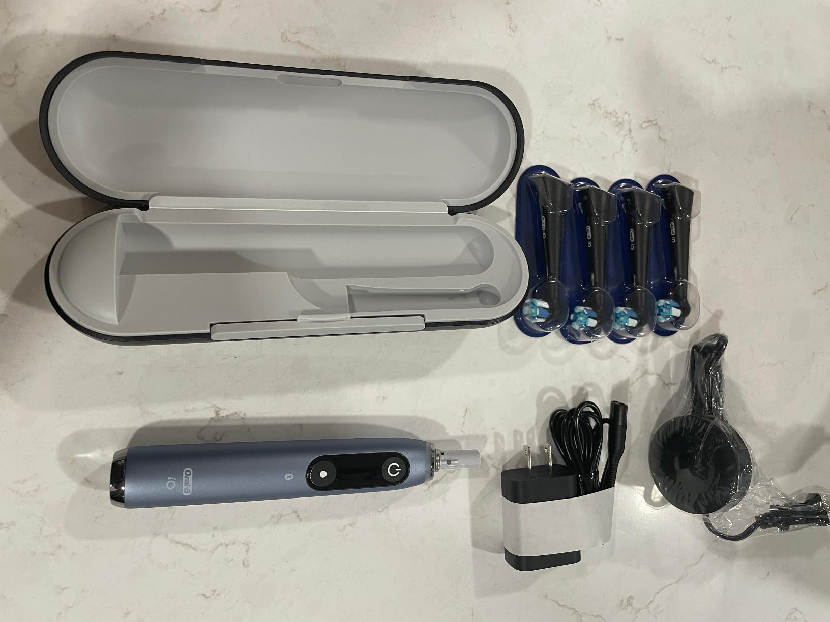 Oral-B Rechargeable Electric Toothbrush, iO Series 9 Genius, Black, 4 Replacement Brush Heads, Power Charging Travel Case, Teeth Whitening, Visible Pressure Sensor to Protect Gums, 7 Modes customer photo 1