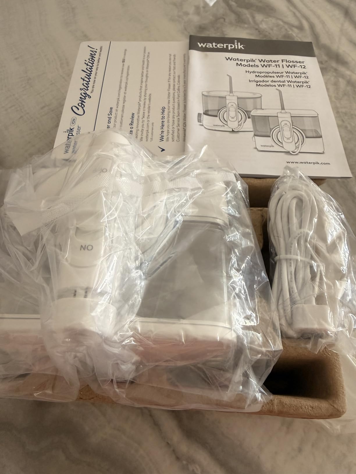 Waterpik ION Rechargeable Water Flosser with 10 Settings, 7 Tips, White customer photo 1