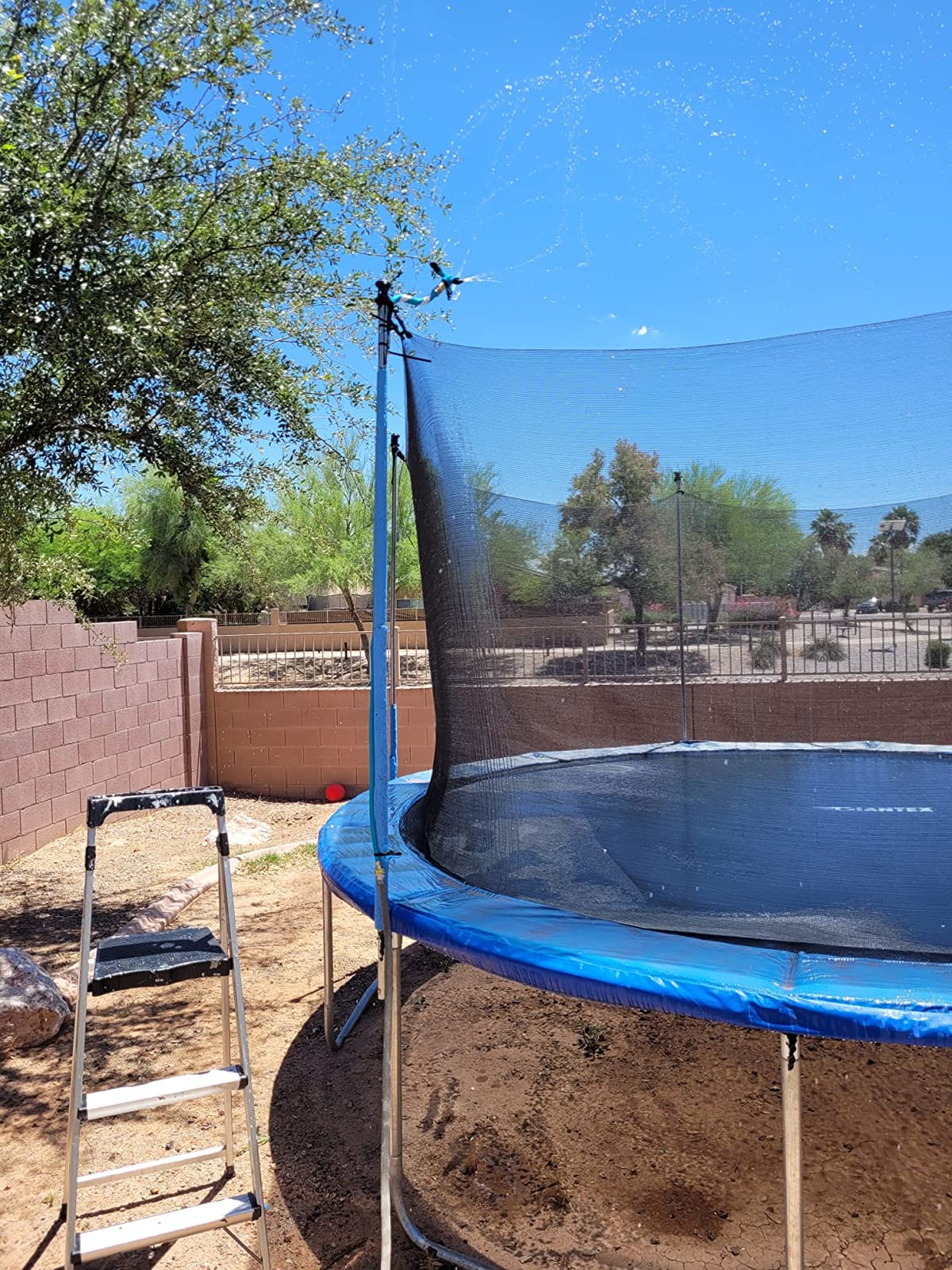 Trampoline Sprinkler - Net Friendly 360 Rotating Water Sprinkler for Kids, 5 Minutes Quick Setup Accessories for 10-16ft Trampolines, Blue customer photo 1