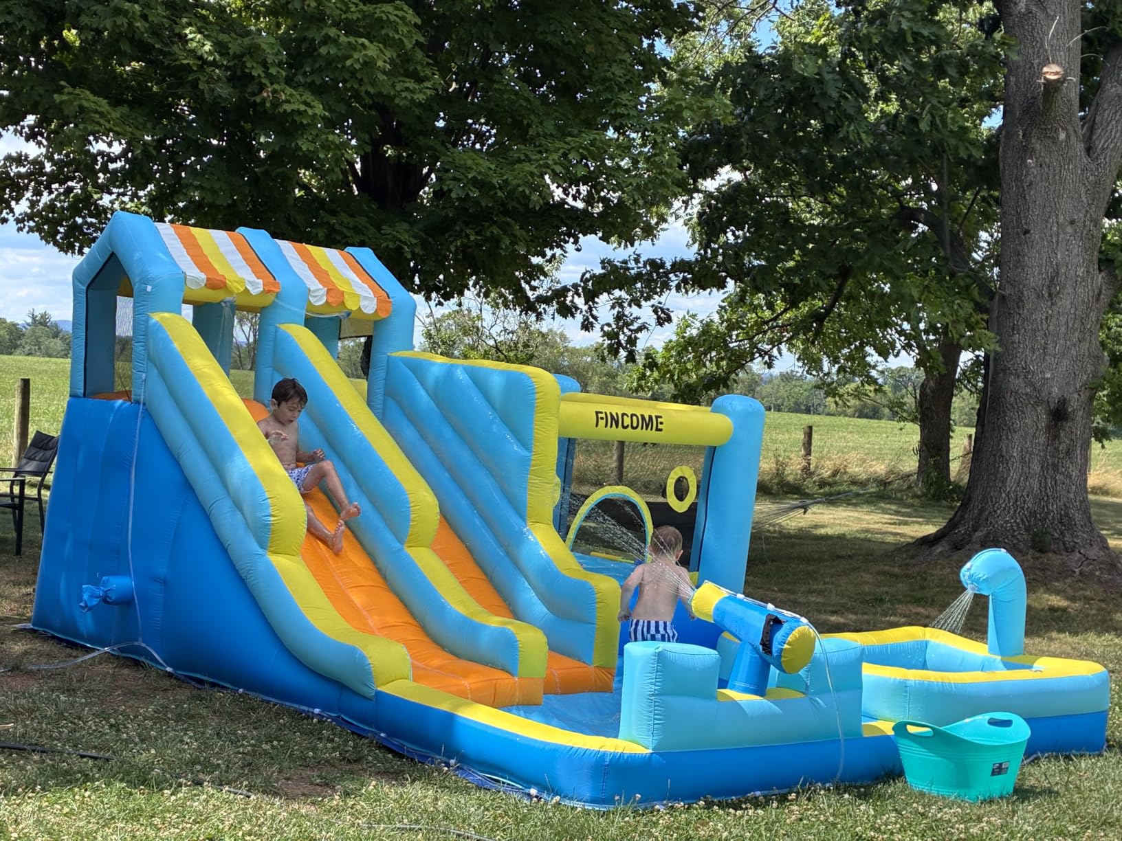 FINCOME Inflatable Bounce House, 10 in 1 Double Water Slide Bounce House with 750W Blower, Climbing Wall, Jumping, Water Gun, Splash Pool, Basketball Hoop for Kids Indoor Outdoor Backyard customer photo 2